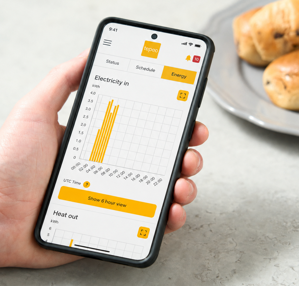 man looking at the tepeo zeb heat battery boiler app